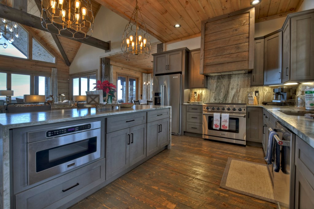 472 Overlook Drive Blue Ridge, GA 30513 - Photo 18 of 70 a kitchen with stainless steel appliances granite countertop a stove and a sink