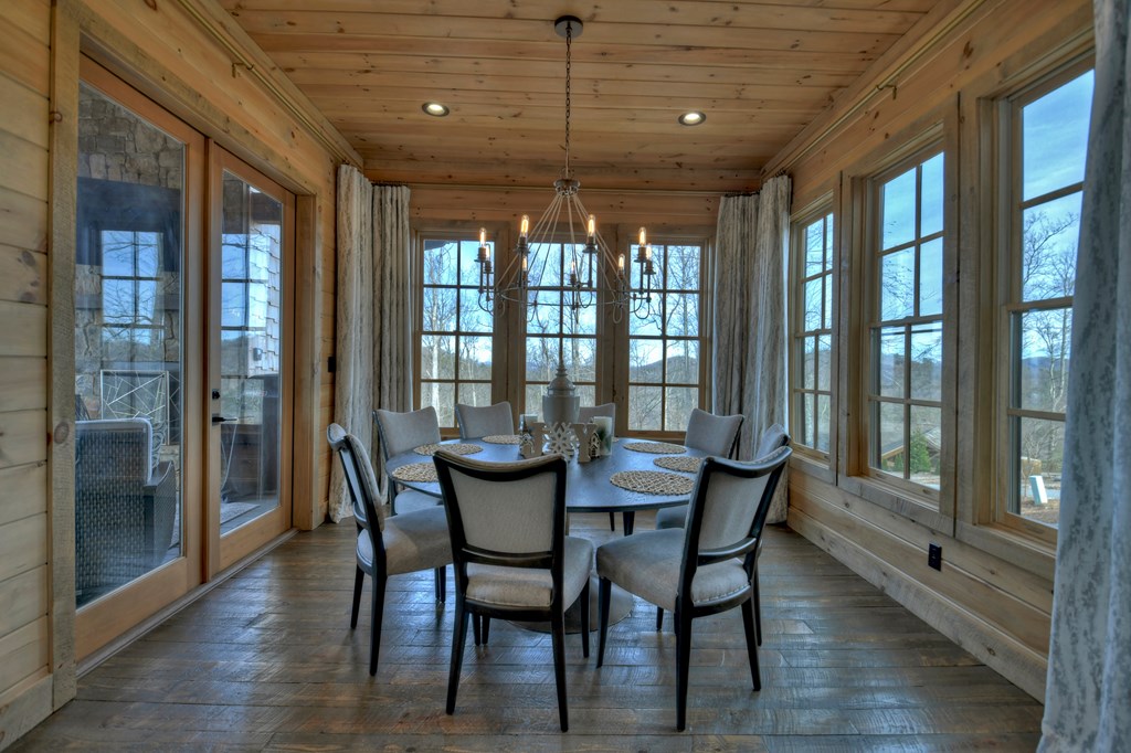 472 Overlook Drive Blue Ridge, GA 30513 - Photo 19 of 70 a view of a dining room with furniture large windows and wooden floor