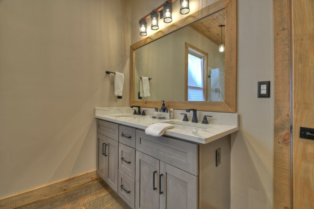 472 Overlook Drive Blue Ridge, GA 30513 - Photo 25 of 70 a bathroom with a sink and a mirror