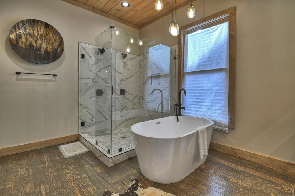 472 Overlook Drive Blue Ridge, GA 30513 - Photo 26 of 70 a bathroom with a bathtub and a shower