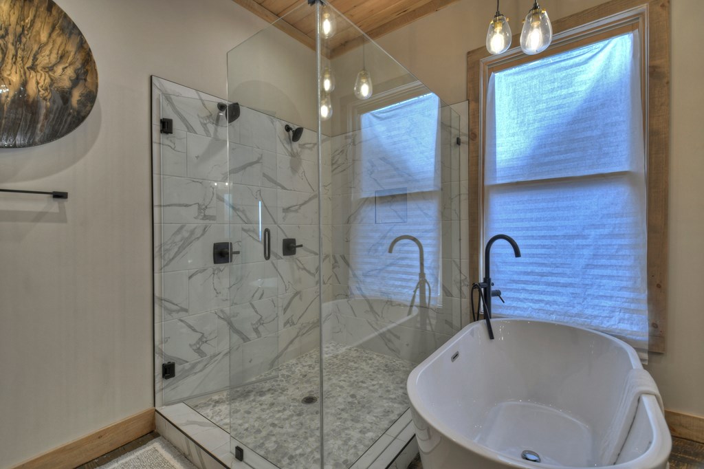 472 Overlook Drive Blue Ridge, GA 30513 - Photo 28 of 70 a bathroom with a sink and a mirror