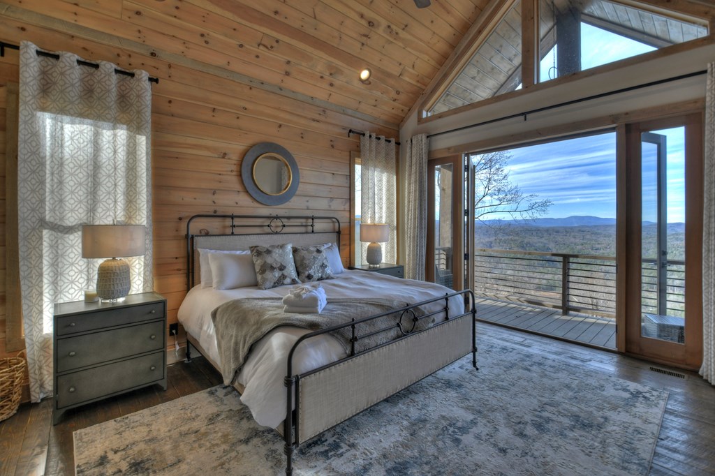 472 Overlook Drive Blue Ridge, GA 30513 - Photo 36 of 70 a bedroom with a bed and a window