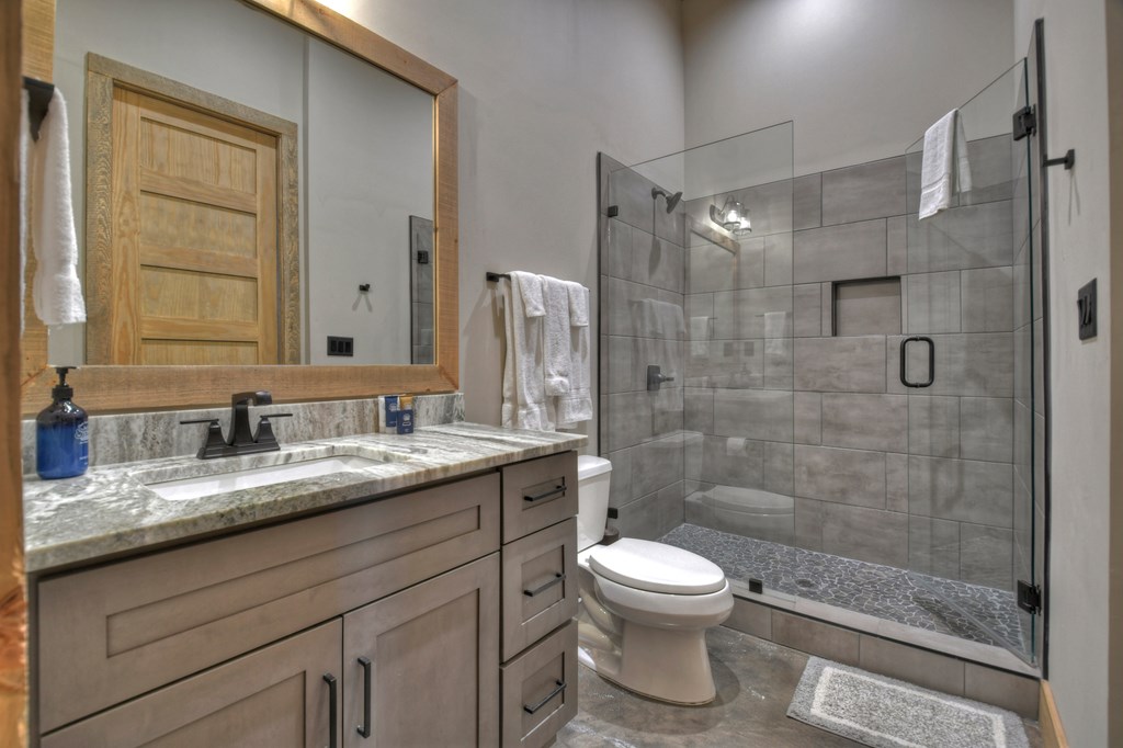 472 Overlook Drive Blue Ridge, GA 30513 - Photo 45 of 70 a bathroom with a granite countertop sink toilet and shower