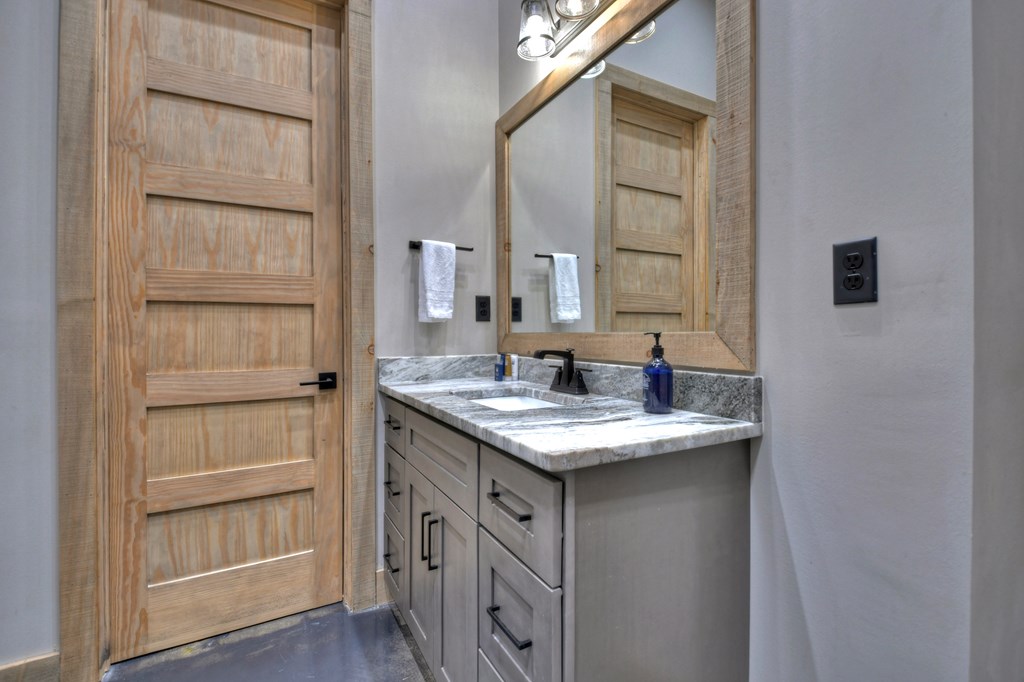 472 Overlook Drive Blue Ridge, GA 30513 - Photo 48 of 70 a bathroom with a sink and a mirror