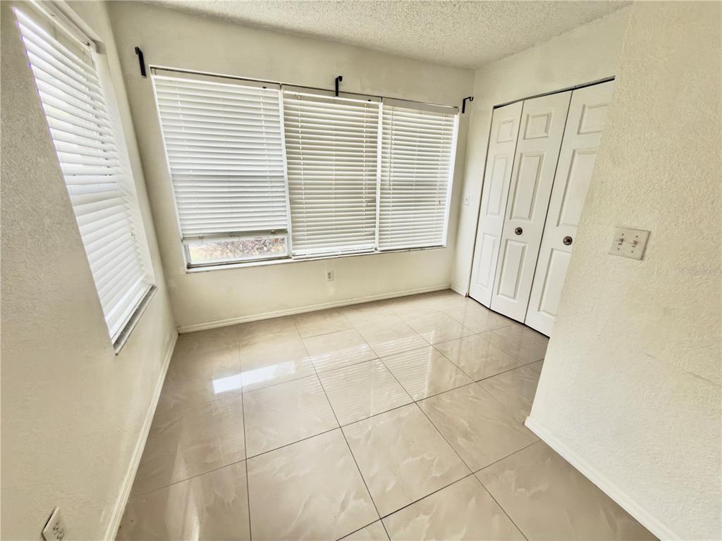 5152 Conroy Road, Unit 17 Orlando, FL 32811 - Photo 20 of 21 a view of an empty room with a window