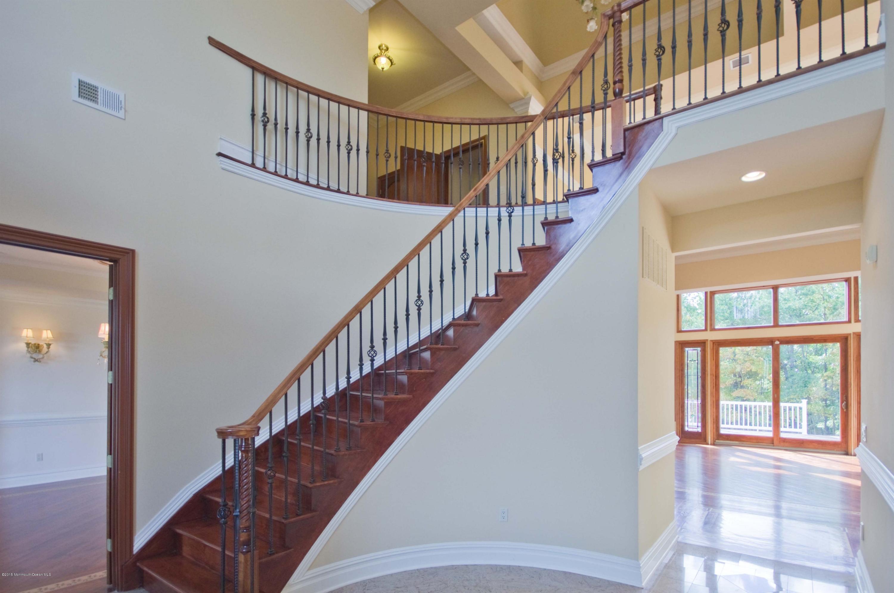 81 Potts Road Robbinsville, NJ 08691 - Photo 2 of 37 a view of staircase with wooden floor and white walls