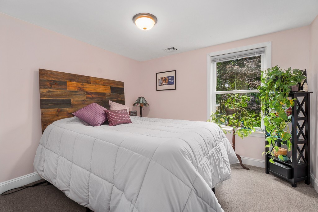 10 Riverbank Road, Unit 3 Maynard, MA 01754 - Photo 12 of 20 a bedroom with a bed and a window