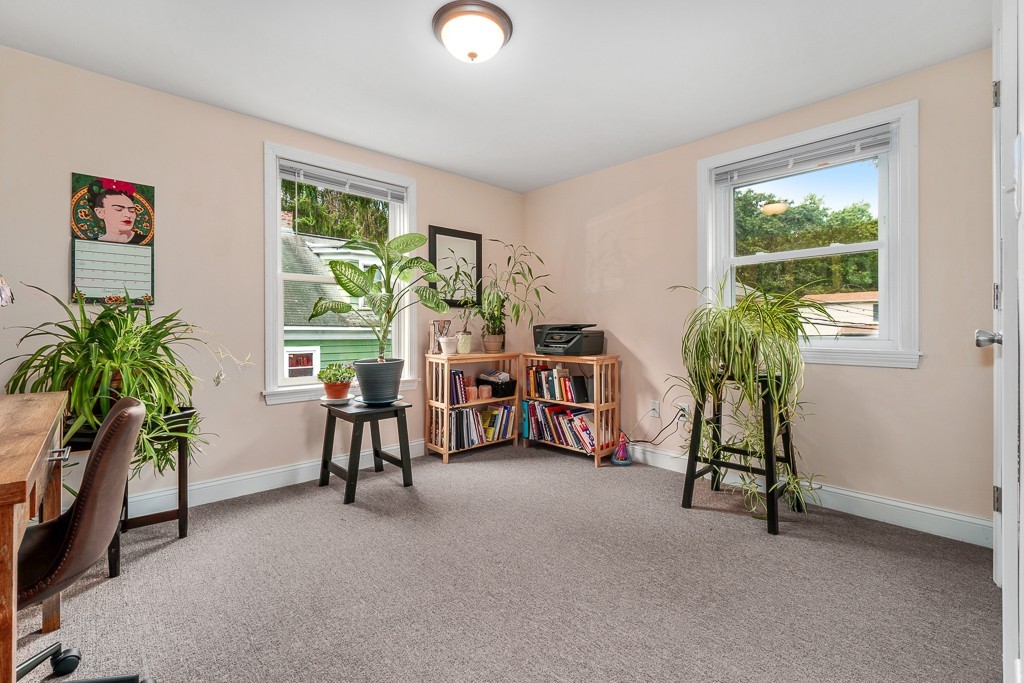 10 Riverbank Road, Unit 3 Maynard, MA 01754 - Photo 15 of 20 a living room with furniture and a potted plant