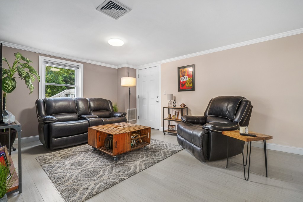10 Riverbank Road, Unit 3 Maynard, MA 01754 - Photo 4 of 20 a living room with furniture and a rug
