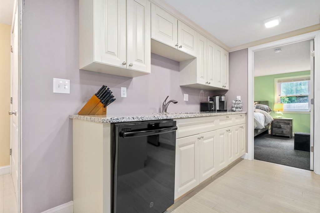 10 Riverbank Road, Unit 3 Maynard, MA 01754 - Photo 8 of 20 a kitchen with stainless steel appliances granite countertop a sink a stove and a refrigerator