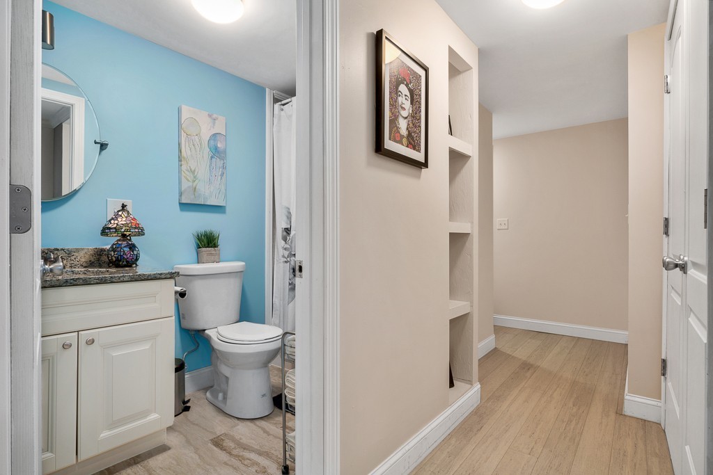 10 Riverbank Road, Unit 3 Maynard, MA 01754 - Photo 10 of 20 a bathroom with a toilet sink and vanity
