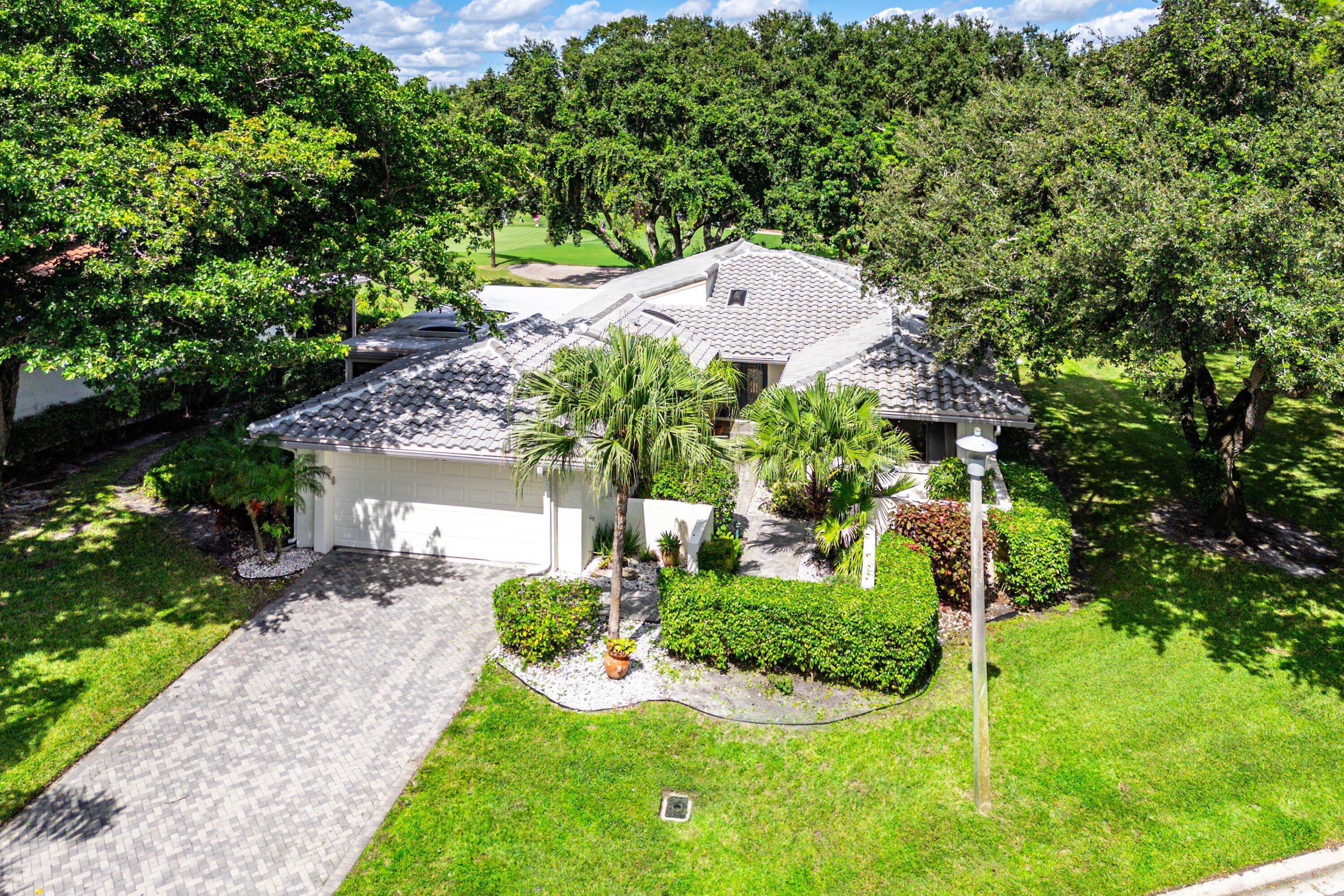 30 Hampshire Lane Boynton Beach, FL 33436 - Photo 2 of 84 a view of a backyard