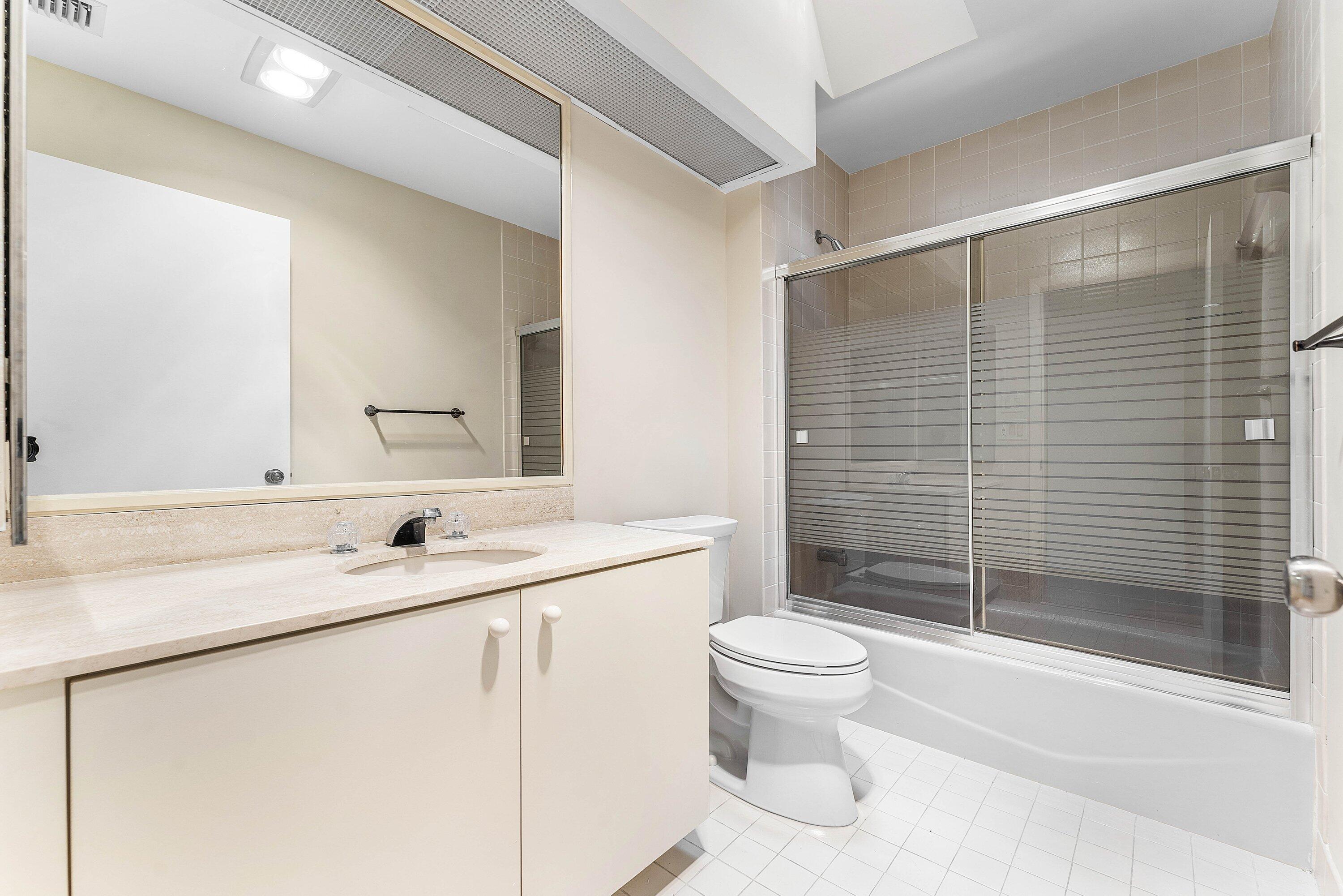 30 Hampshire Lane Boynton Beach, FL 33436 - Photo 31 of 84 a bathroom with a sink toilet and shower