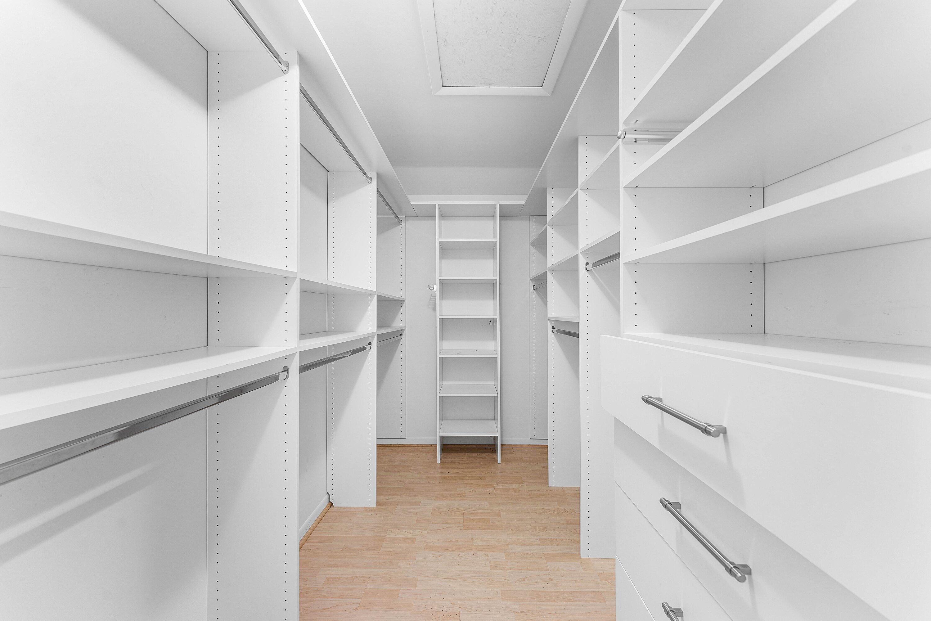 30 Hampshire Lane Boynton Beach, FL 33436 - Photo 37 of 84 a view of walk in closet with empty racks