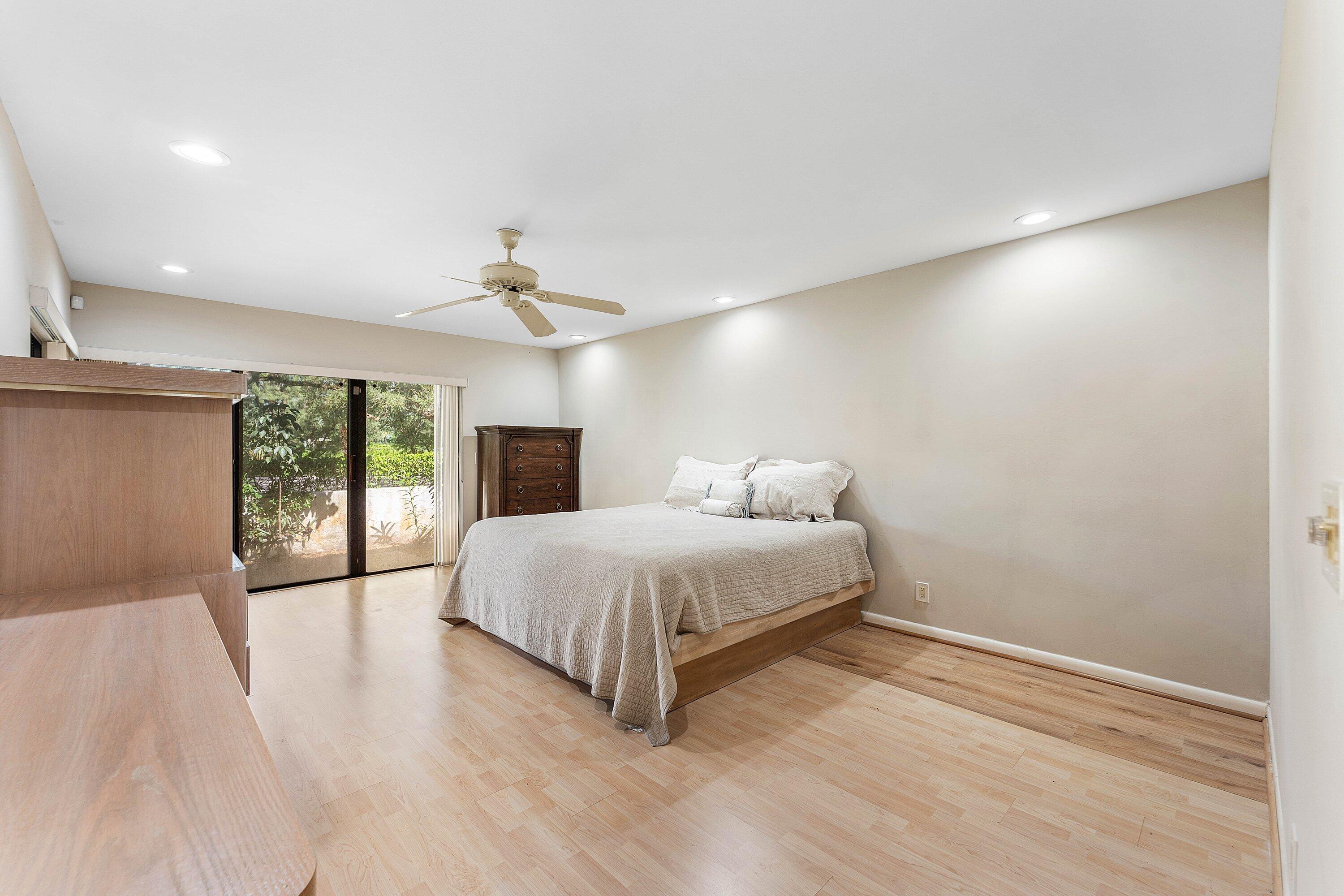 30 Hampshire Lane Boynton Beach, FL 33436 - Photo 38 of 84 a spacious bedroom with a bed and a large window