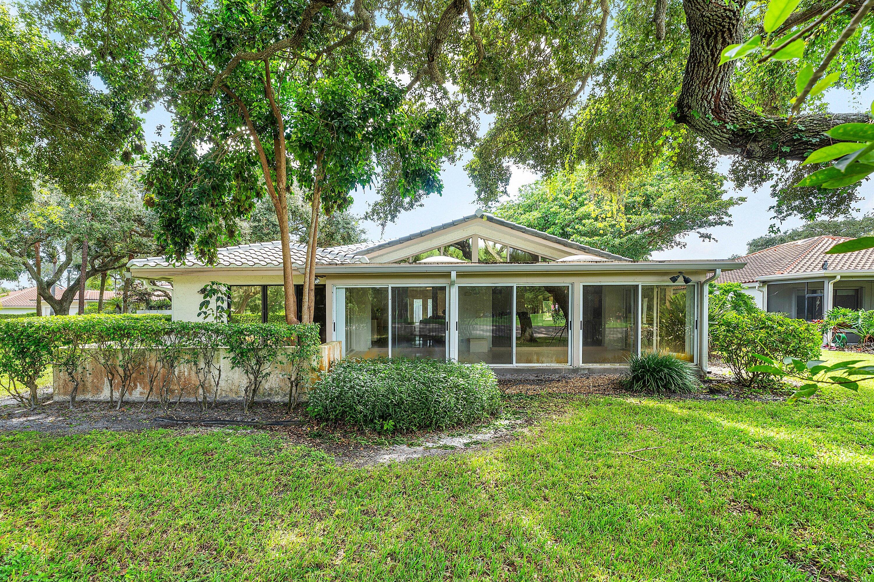 30 Hampshire Lane Boynton Beach, FL 33436 - Photo 45 of 84 a front view of a house with garden