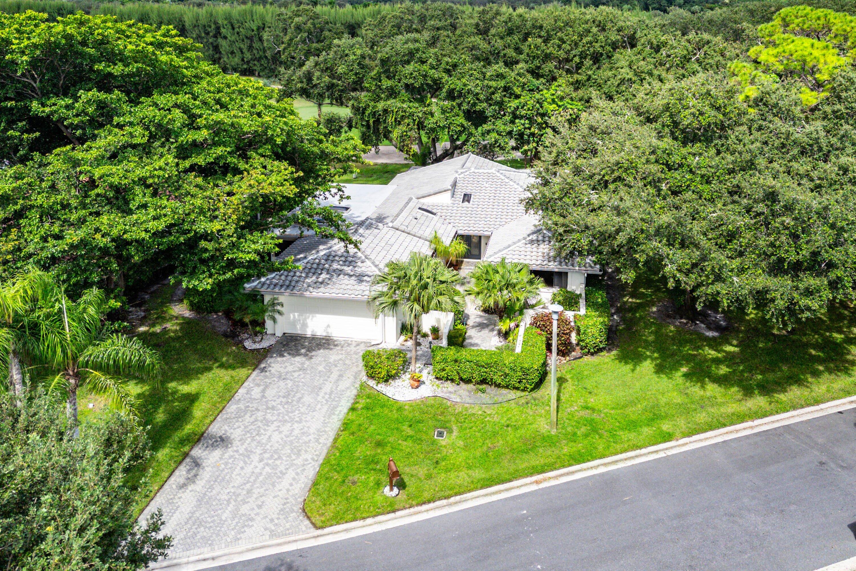 30 Hampshire Lane Boynton Beach, FL 33436 - Photo 50 of 84 a aerial view of a house with a garden and plants