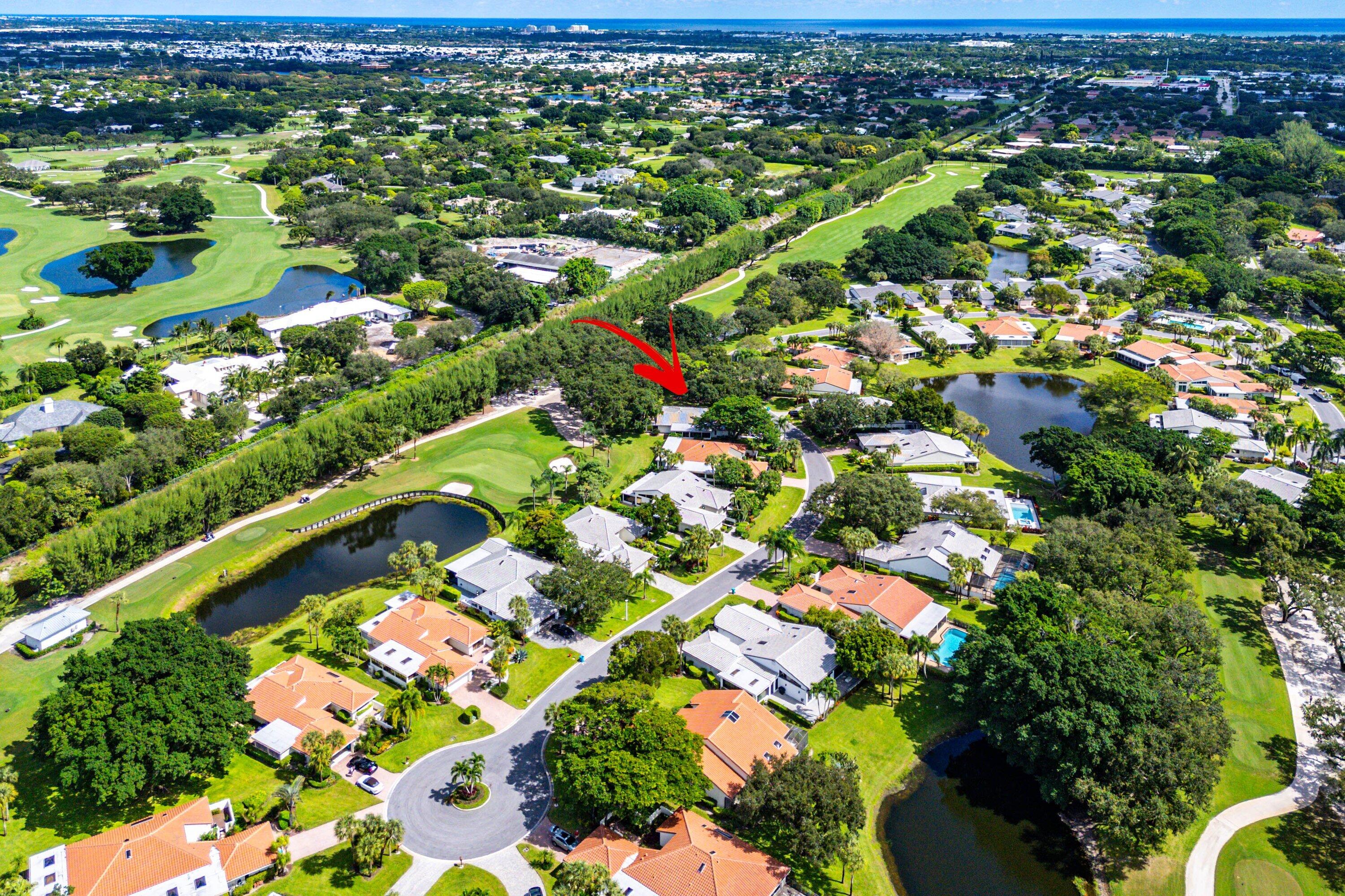 30 Hampshire Lane Boynton Beach, FL 33436 - Photo 60 of 84 an aerial view of residential houses with outdoor space and trees