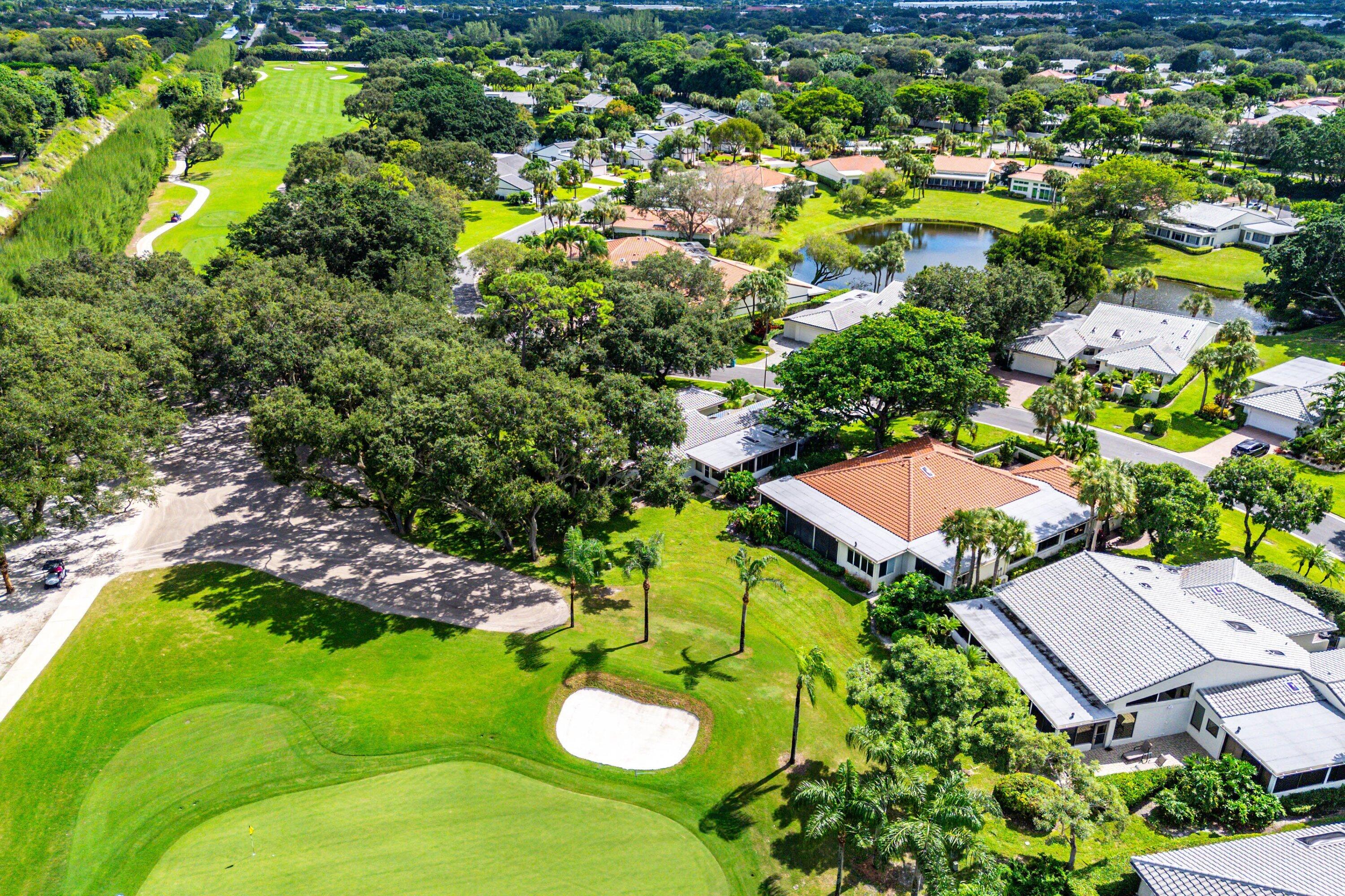 30 Hampshire Lane Boynton Beach, FL 33436 - Photo 64 of 84 a view of a swimming pool with a garden