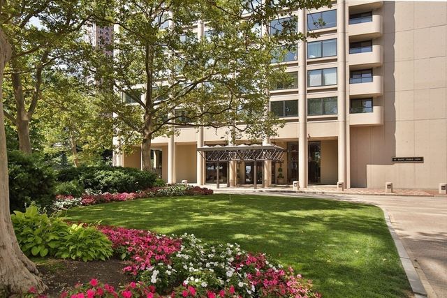 front view of a building with a yard