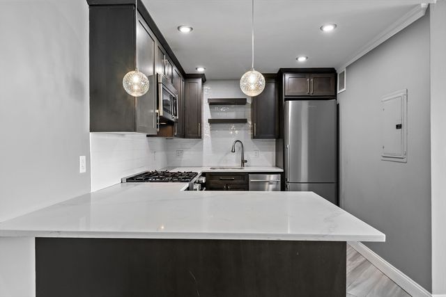 a kitchen with a table and chairs in it