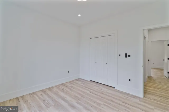 a view of room with wooden floor