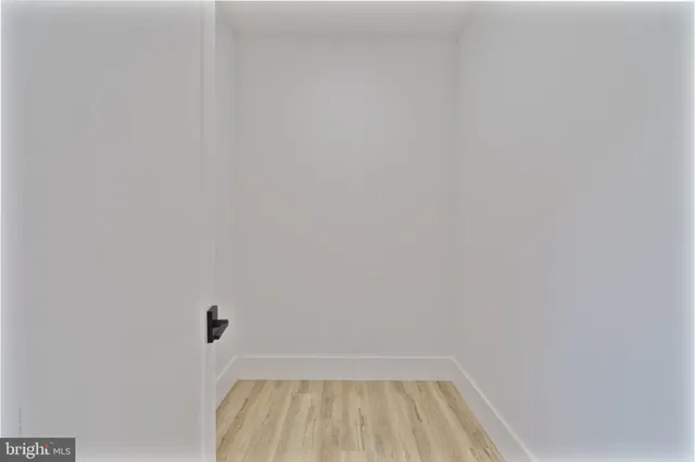 a view of a bathroom with wooden floor