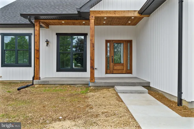 a view of a door of a house with a tub