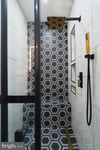 a bathroom with a toilet and a shower curtain