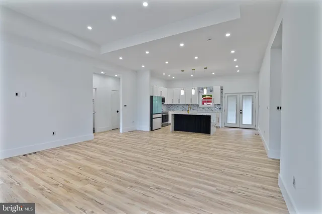 a view of kitchen and stainless steel appliances with kitchen island