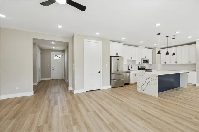 a view of kitchen with wooden floor