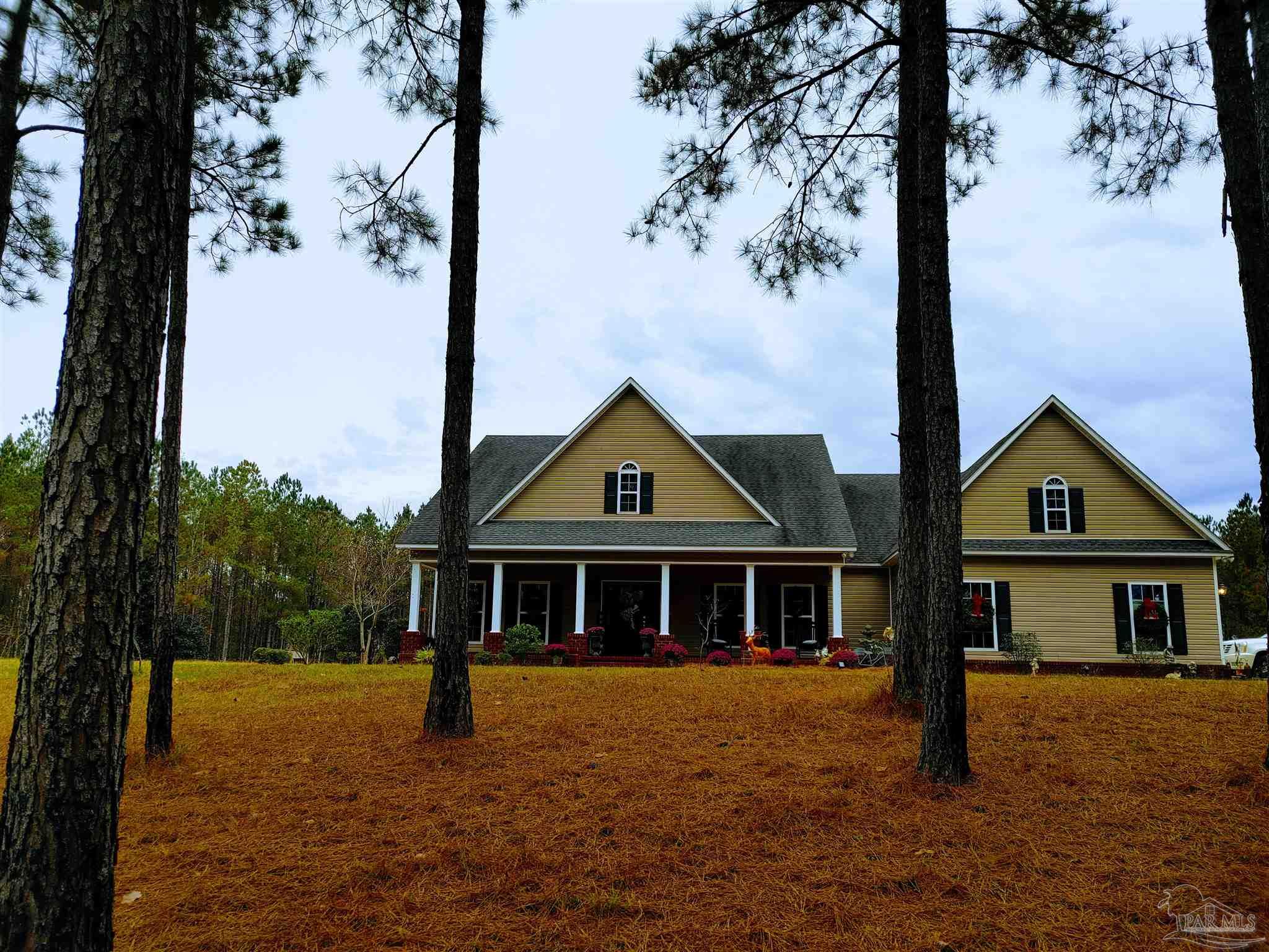 415 Clark Road Gilbertown, AL 36908 - Photo 1 of 50 a front view of a house with a yard