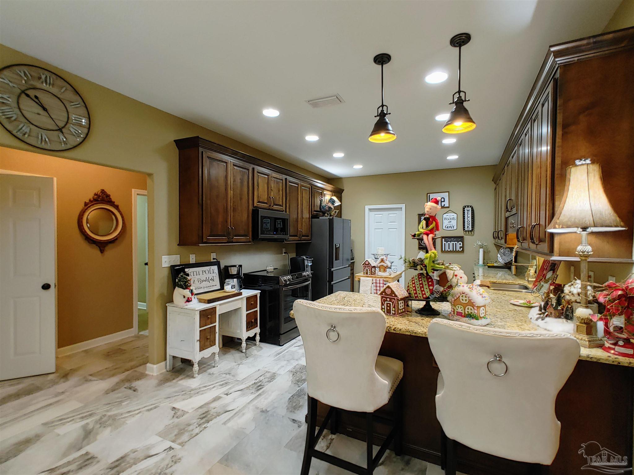 415 Clark Road Gilbertown, AL 36908 - Photo 13 of 50 a view of a dining room with furniture