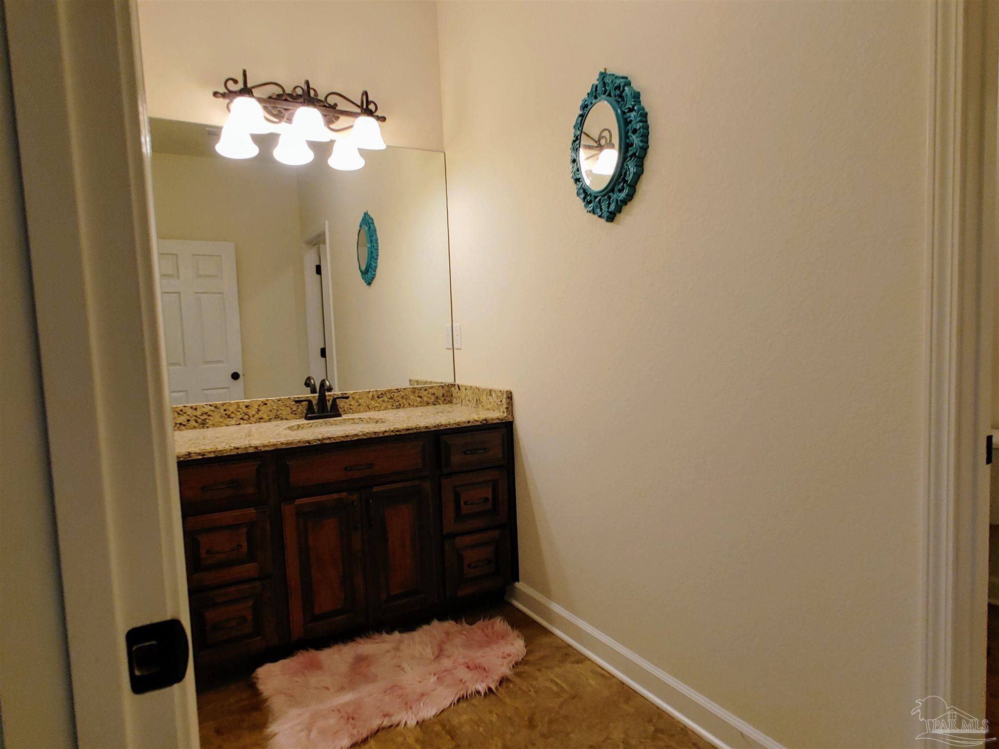 415 Clark Road Gilbertown, AL 36908 - Photo 28 of 50 a bathroom with a sink and a mirror