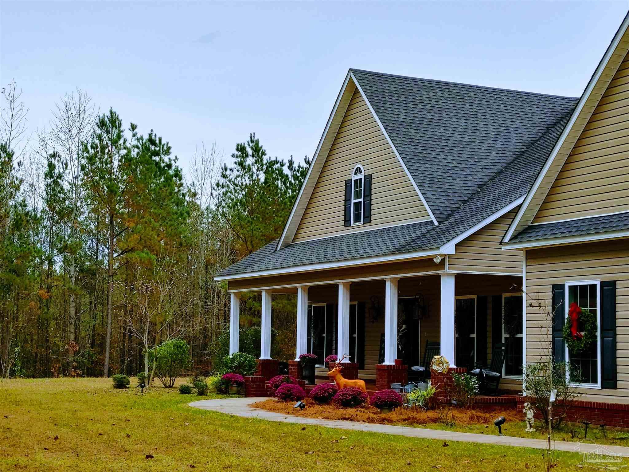 415 Clark Road Gilbertown, AL 36908 - Photo 32 of 50 front view of a house with a yard