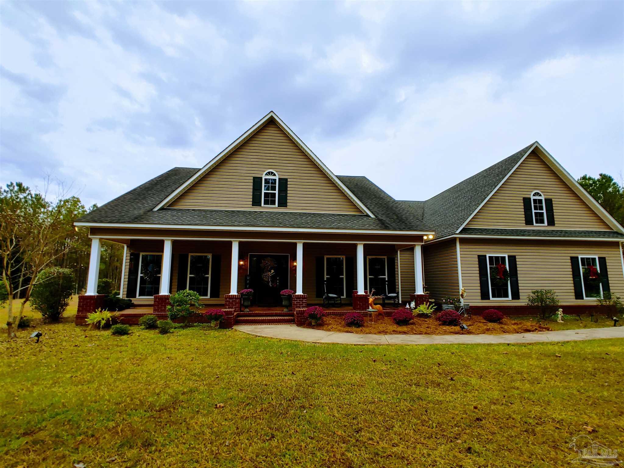 415 Clark Road Gilbertown, AL 36908 - Photo 40 of 50 a front view of a house with swimming pool and chairs