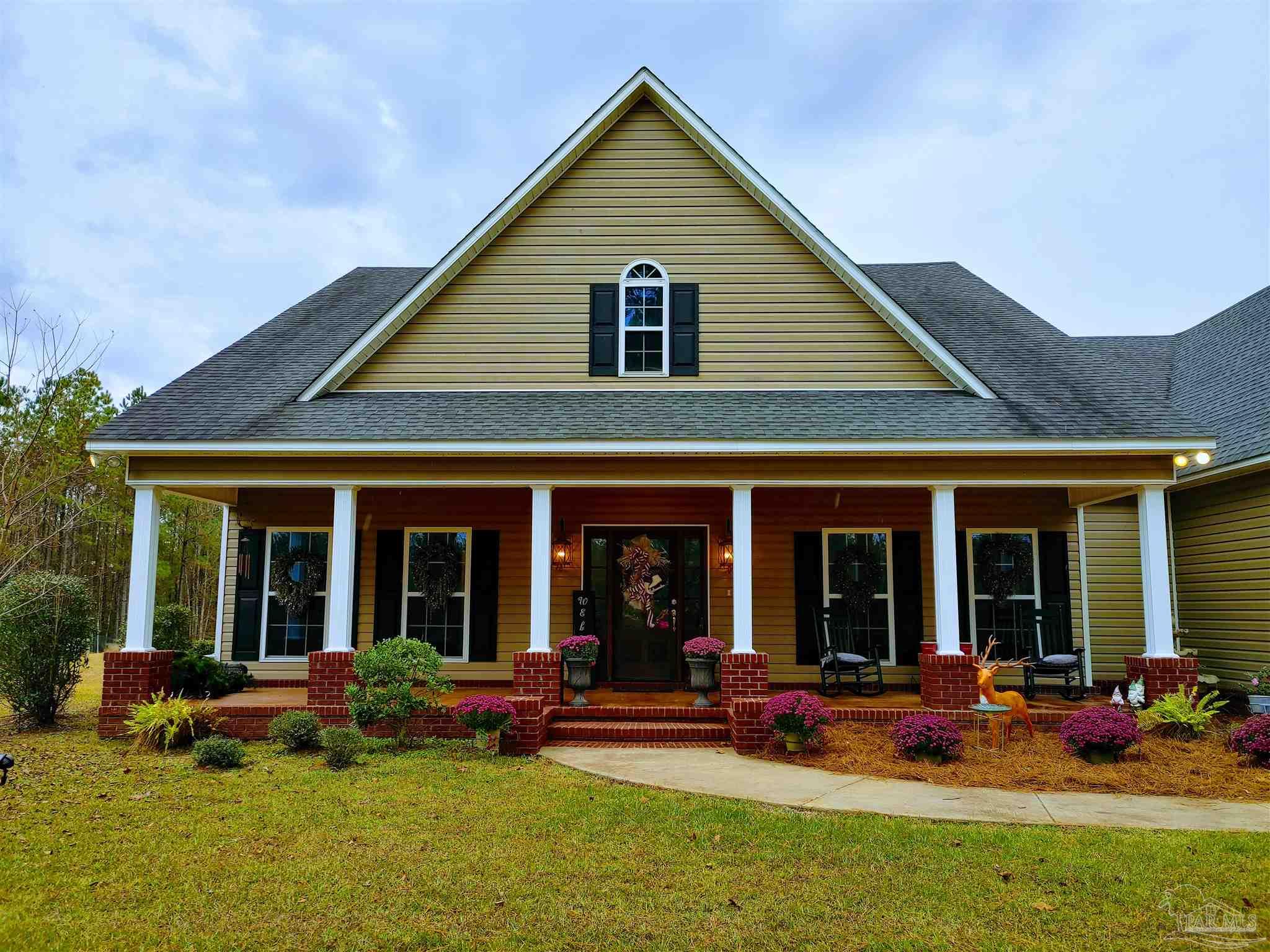 415 Clark Road Gilbertown, AL 36908 - Photo 41 of 50 a view of a house with sitting area and garden