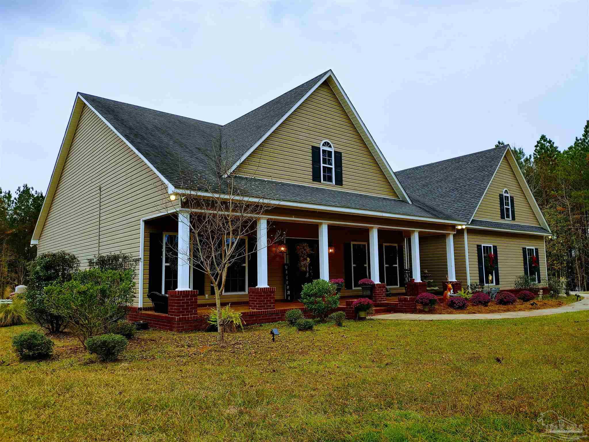 415 Clark Road Gilbertown, AL 36908 - Photo 42 of 50 a view of a house with a yard patio and palm tree