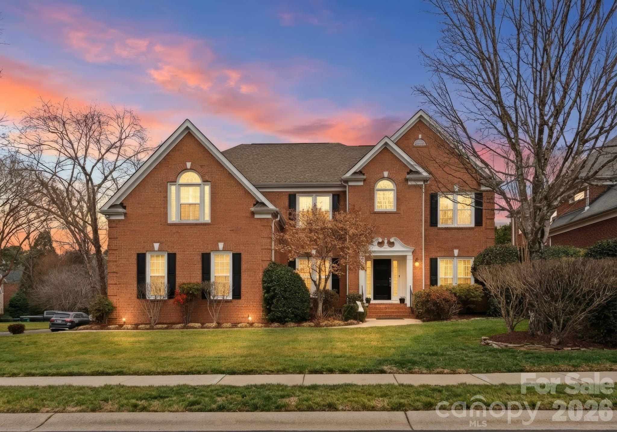 10012 Paradise Ridge Road Charlotte, NC 28277 - Photo 1 of 48 a front view of a house with garden
