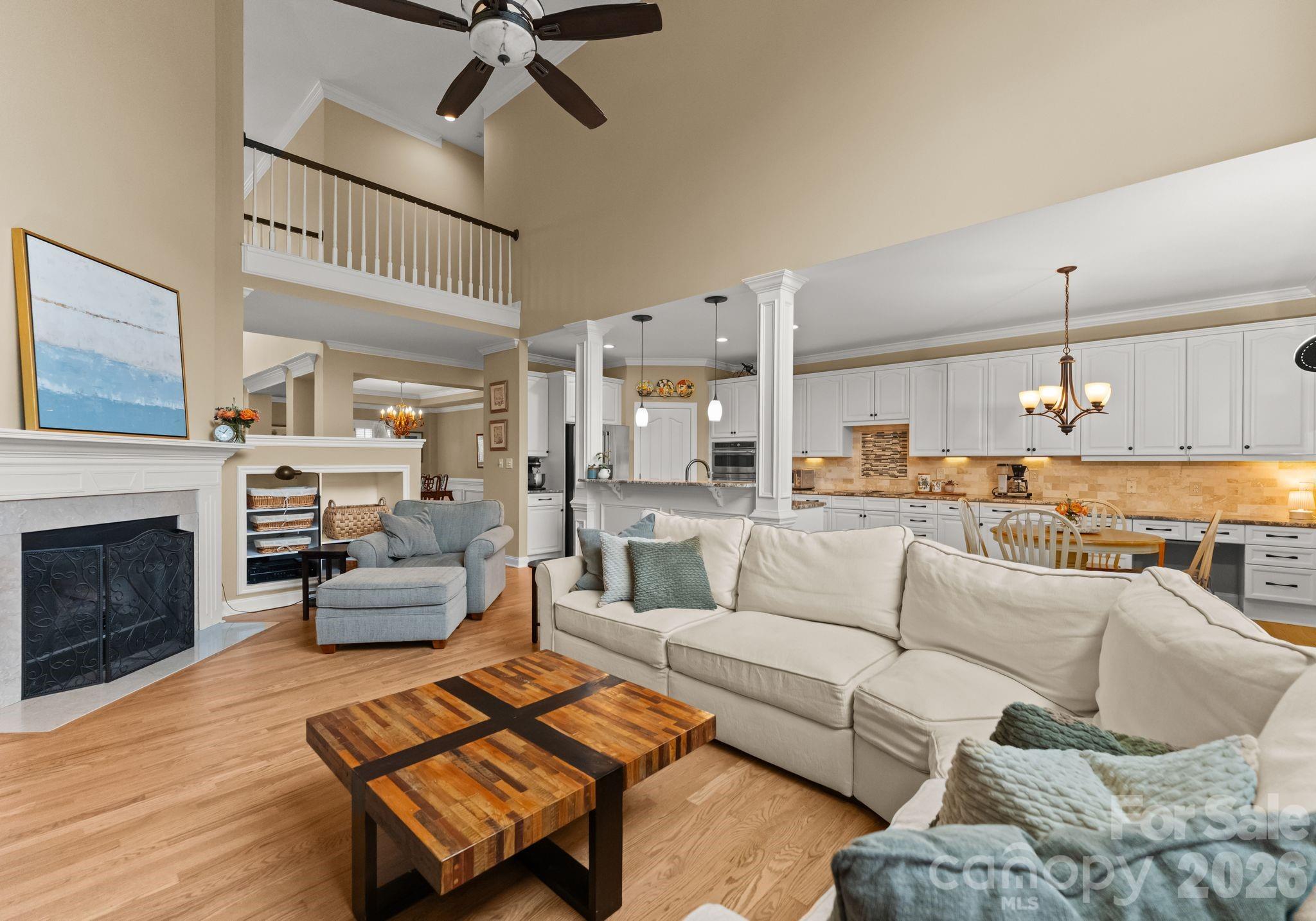 10012 Paradise Ridge Road Charlotte, NC 28277 - Photo 12 of 48 a living room with furniture and a fireplace
