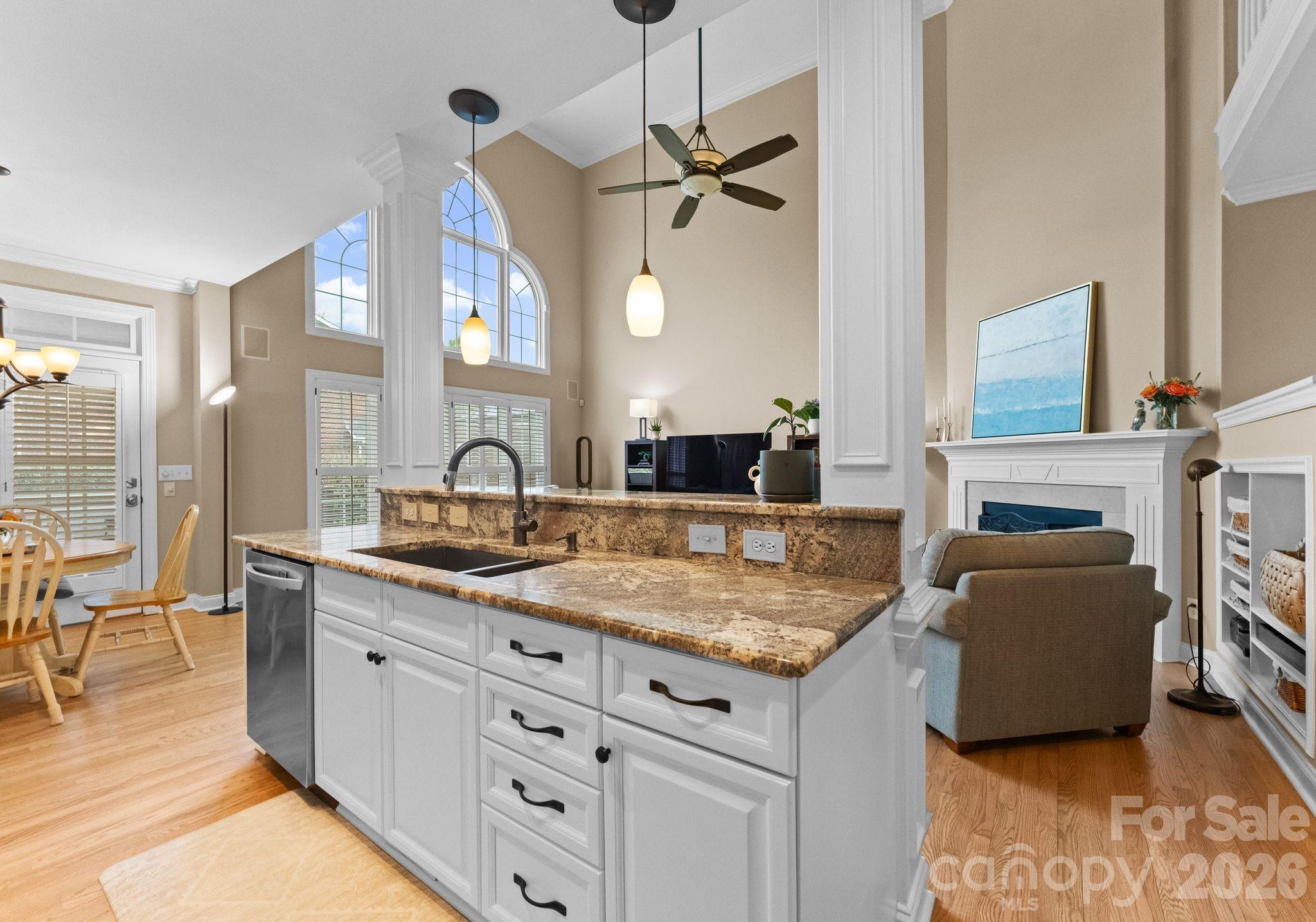10012 Paradise Ridge Road Charlotte, NC 28277 - Photo 16 of 48 a view of living room with granite countertop furniture and fireplace