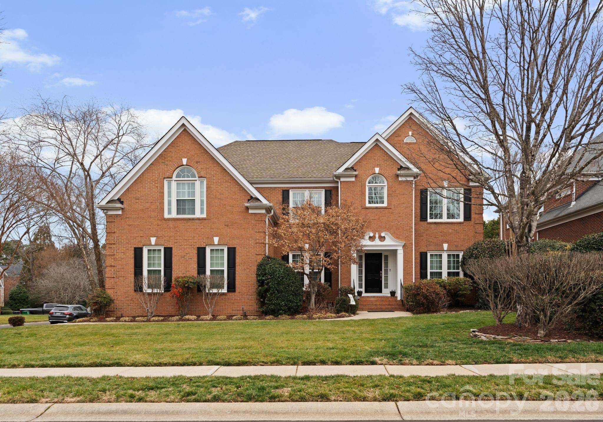 10012 Paradise Ridge Road Charlotte, NC 28277 - Photo 2 of 48 a front view of a house with a yard
