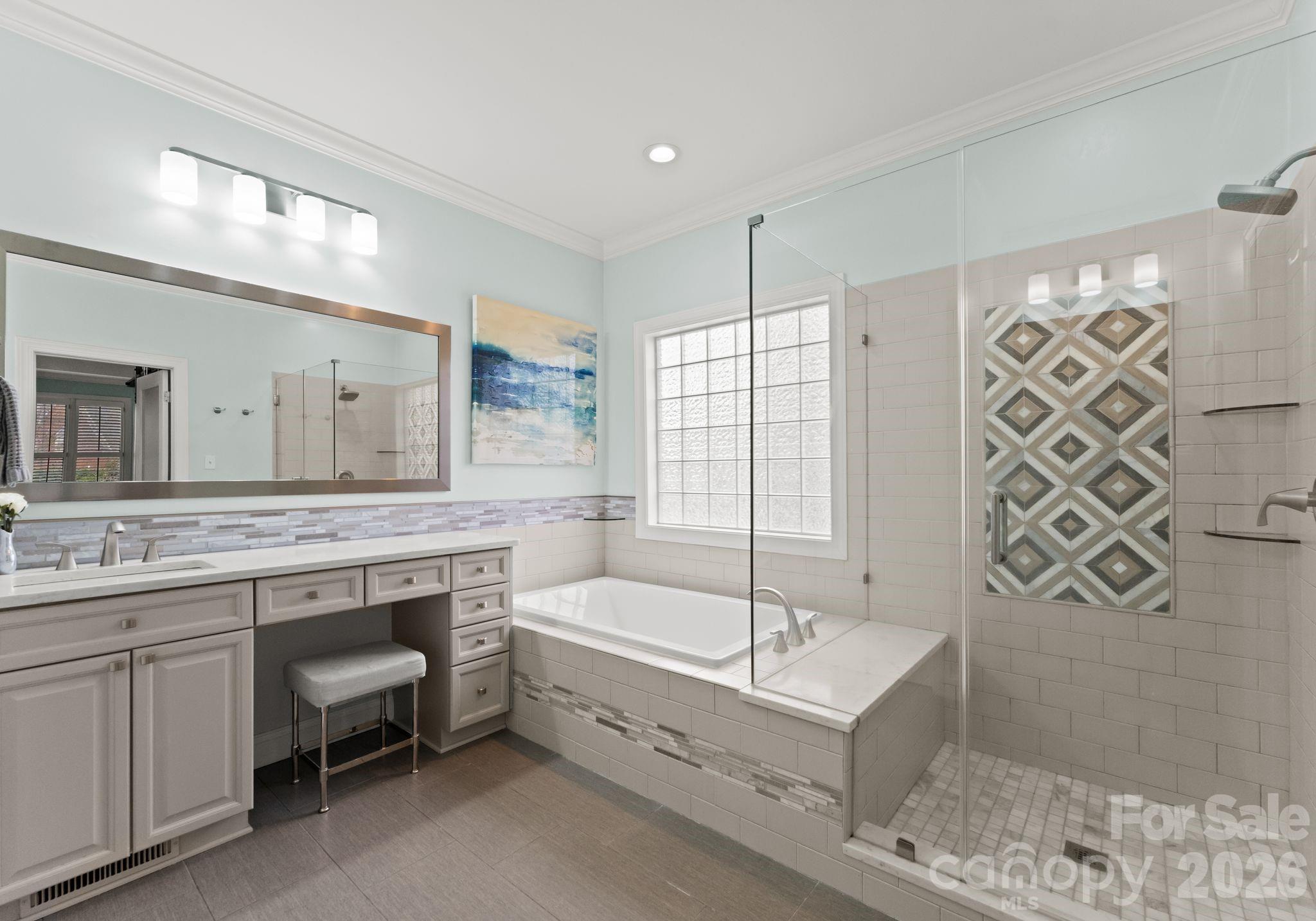 10012 Paradise Ridge Road Charlotte, NC 28277 - Photo 21 of 48 a bathroom with a tub a sink and a shower