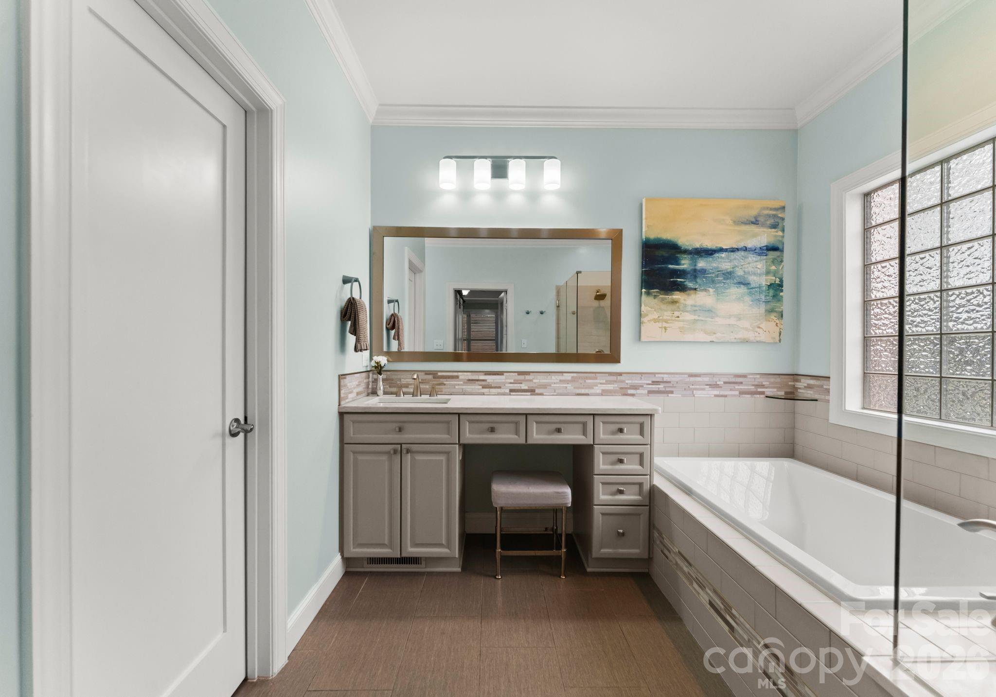 10012 Paradise Ridge Road Charlotte, NC 28277 - Photo 22 of 48 a bathroom with a granite countertop sink mirror and a bathtub