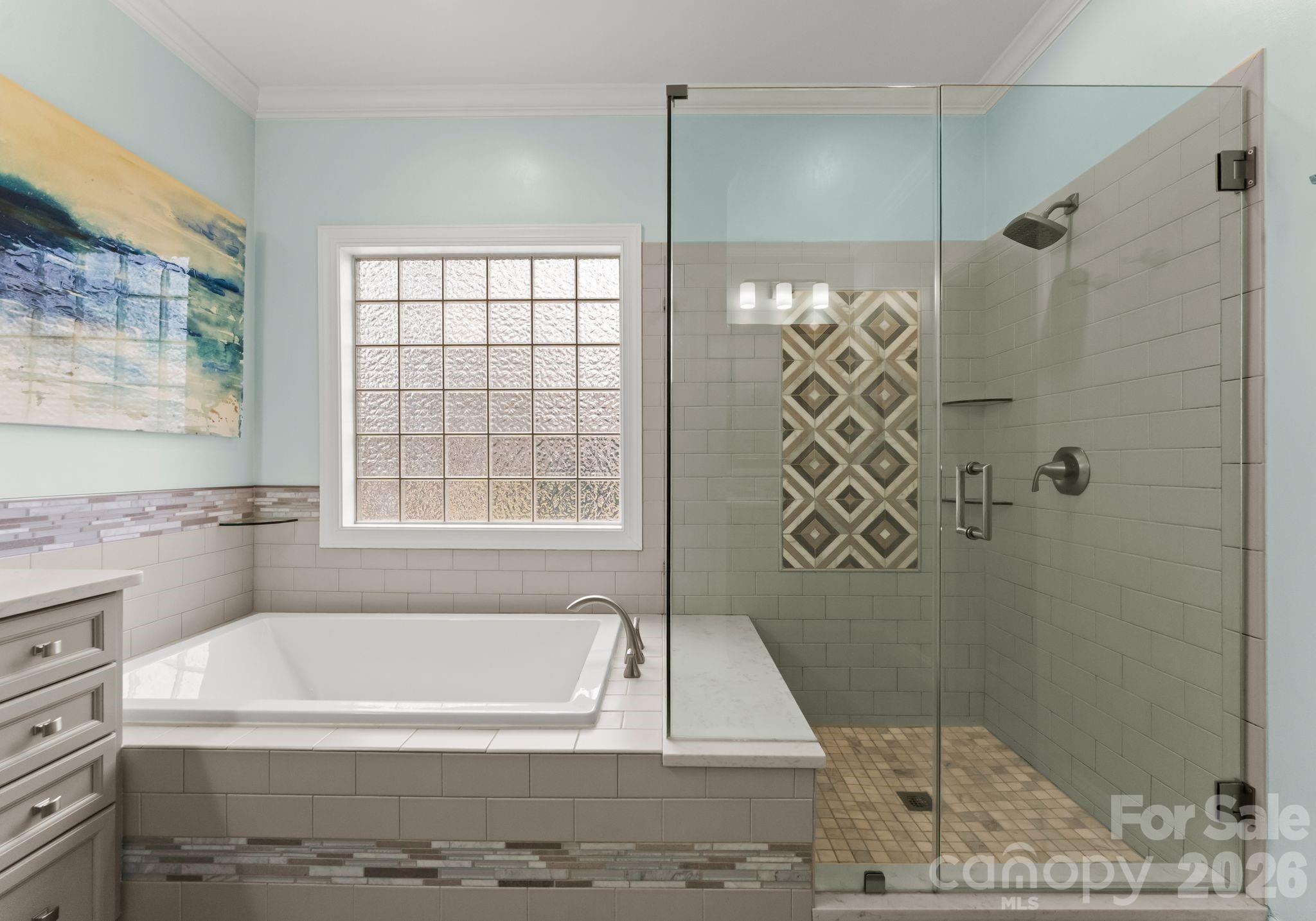 10012 Paradise Ridge Road Charlotte, NC 28277 - Photo 23 of 48 a bathroom with a bathtub and shower