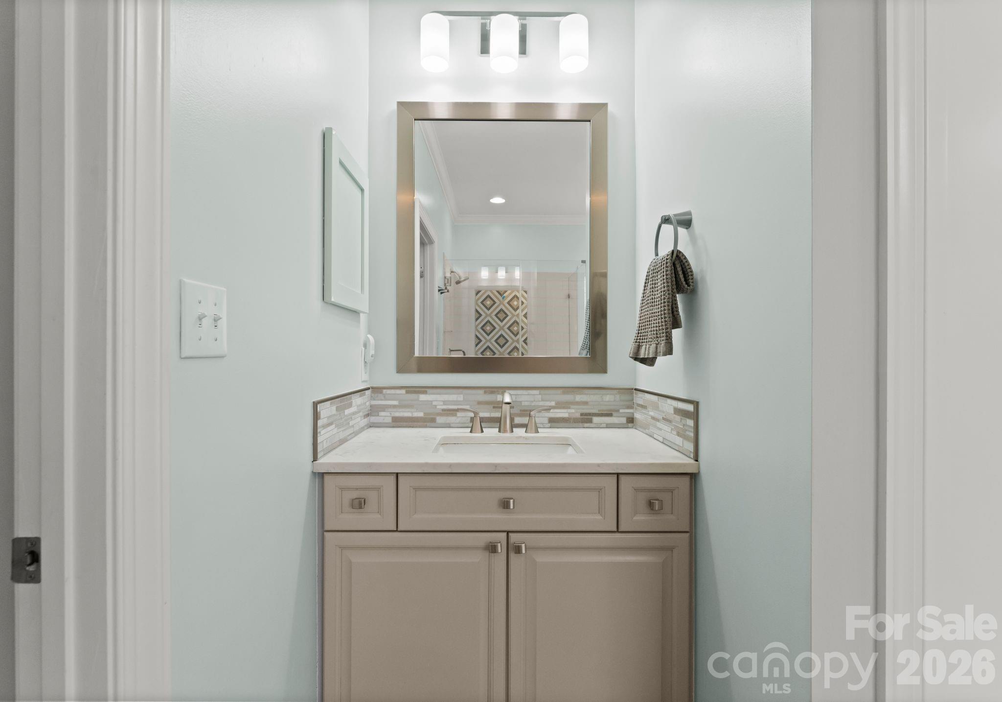 10012 Paradise Ridge Road Charlotte, NC 28277 - Photo 24 of 48 a bathroom with a granite countertop sink a vanity and a large mirror