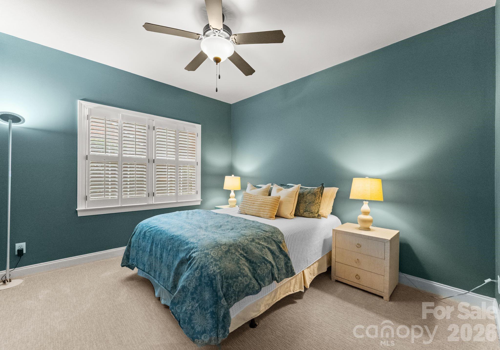 10012 Paradise Ridge Road Charlotte, NC 28277 - Photo 25 of 48 a bedroom with a bed chandelier and a window