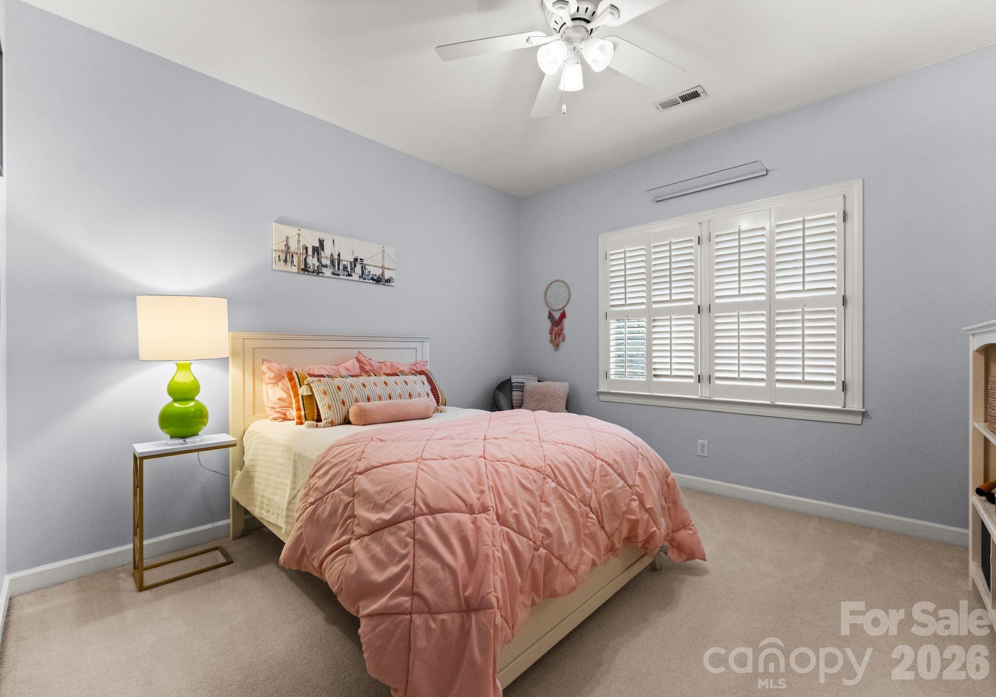10012 Paradise Ridge Road Charlotte, NC 28277 - Photo 29 of 48 a bedroom with a bed table and window