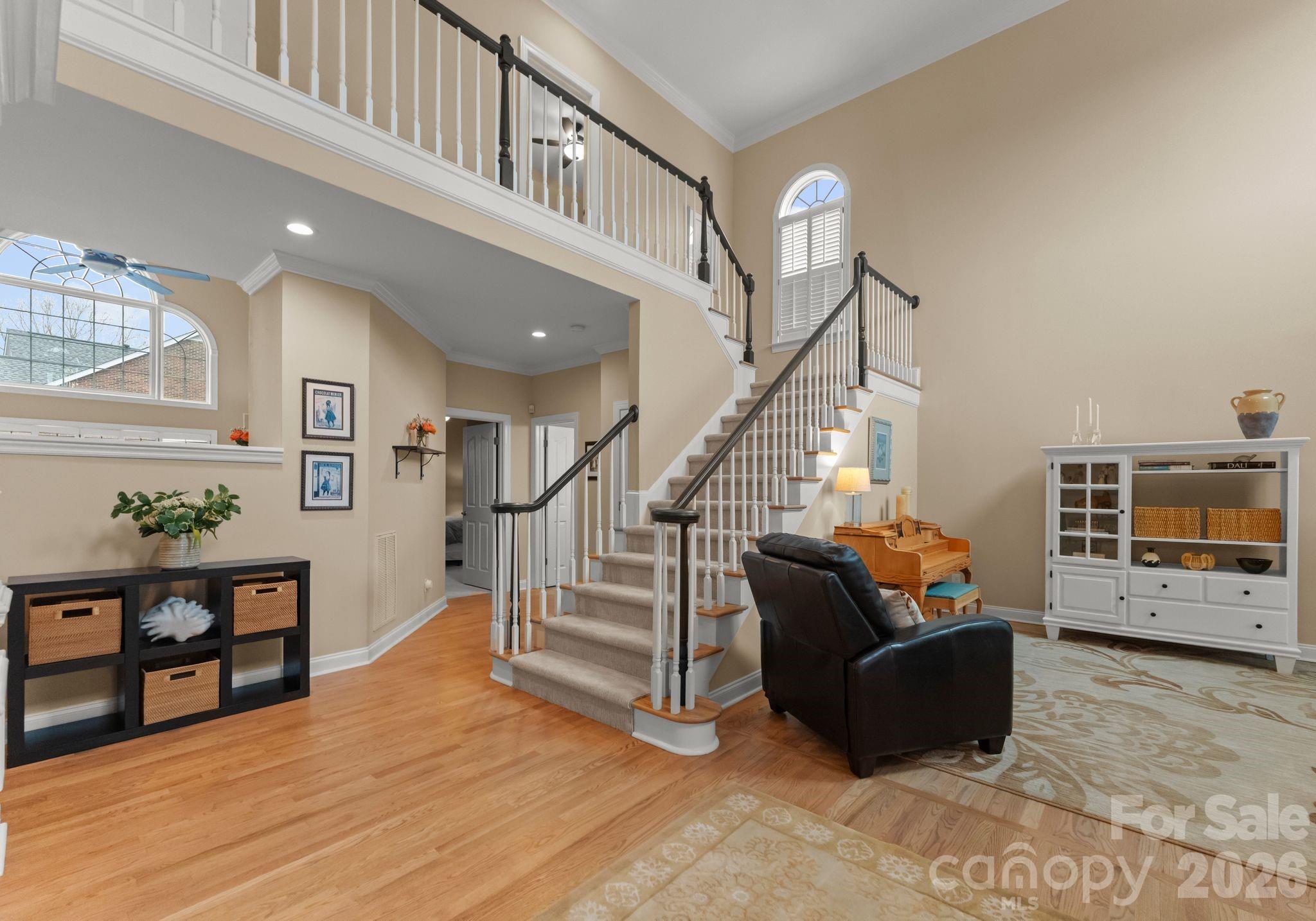 10012 Paradise Ridge Road Charlotte, NC 28277 - Photo 3 of 48 a living room with furniture and stairs