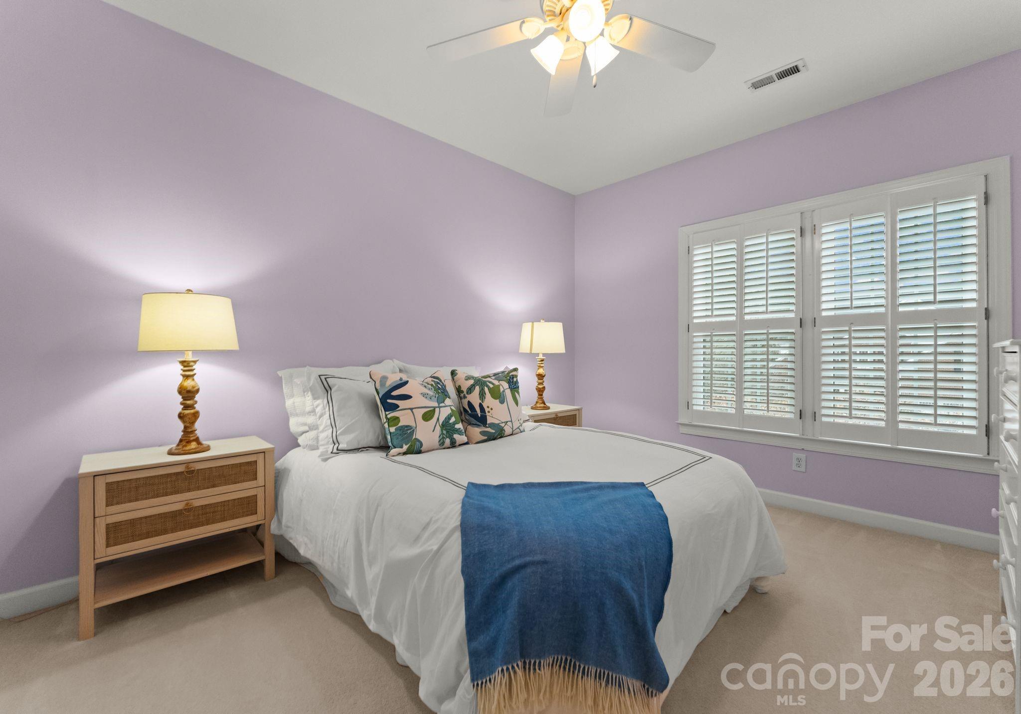 10012 Paradise Ridge Road Charlotte, NC 28277 - Photo 32 of 48 a bedroom with bed and a chandelier